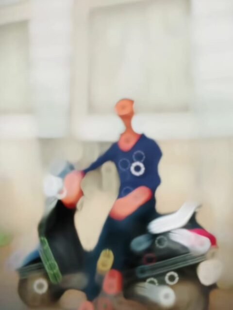 Blurry figure on a scooter